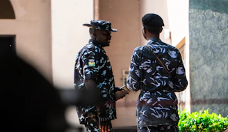 A couple of men standing next to each other