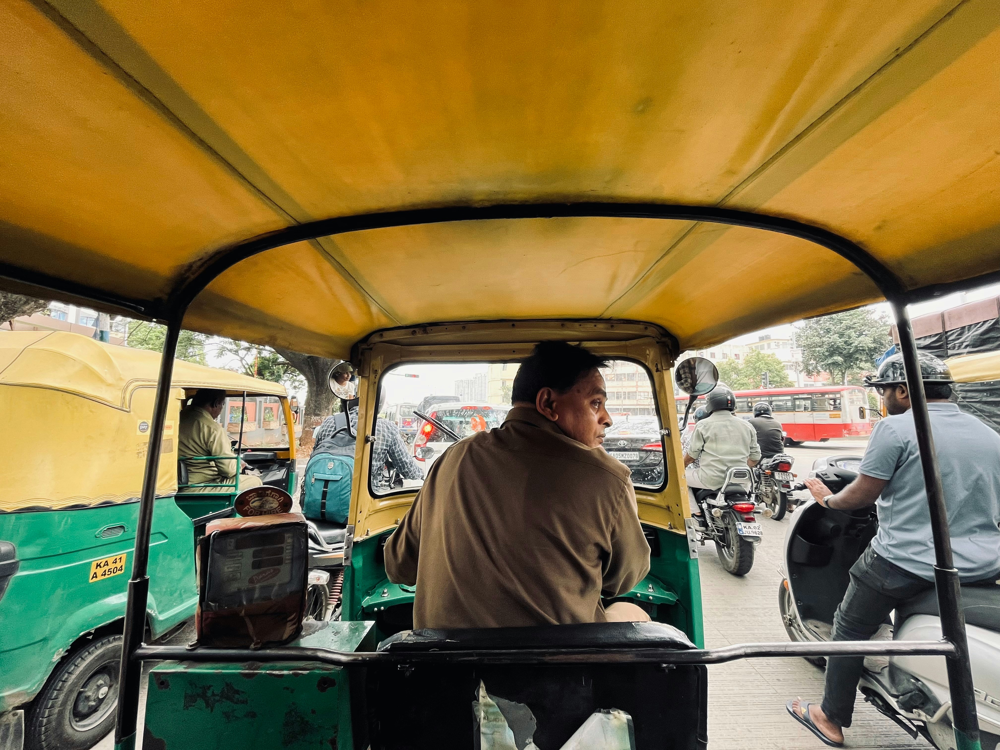 Passenger relaxing in the back seat of an electric rideshare vehicle