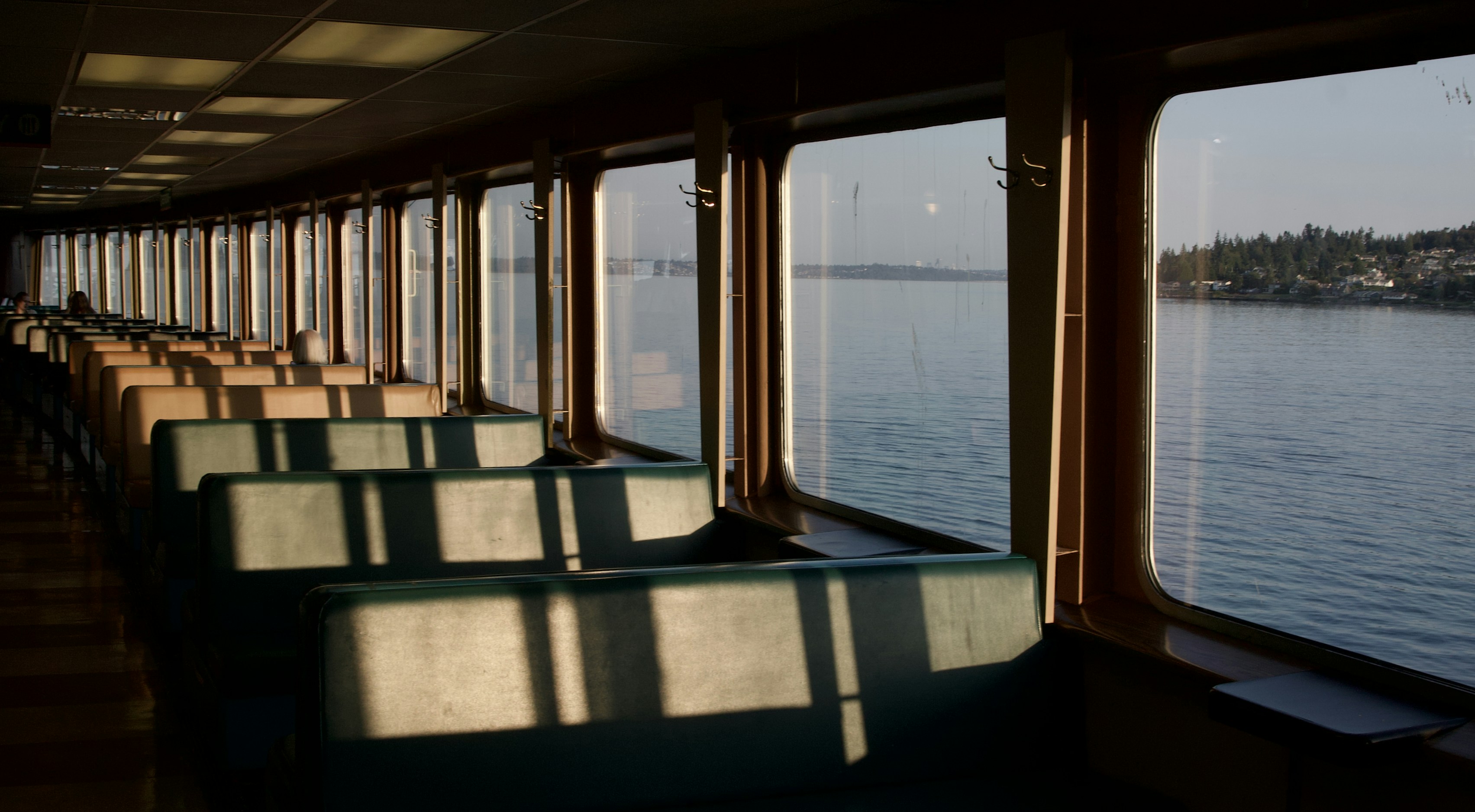 A long row of seats sitting on top of a boat