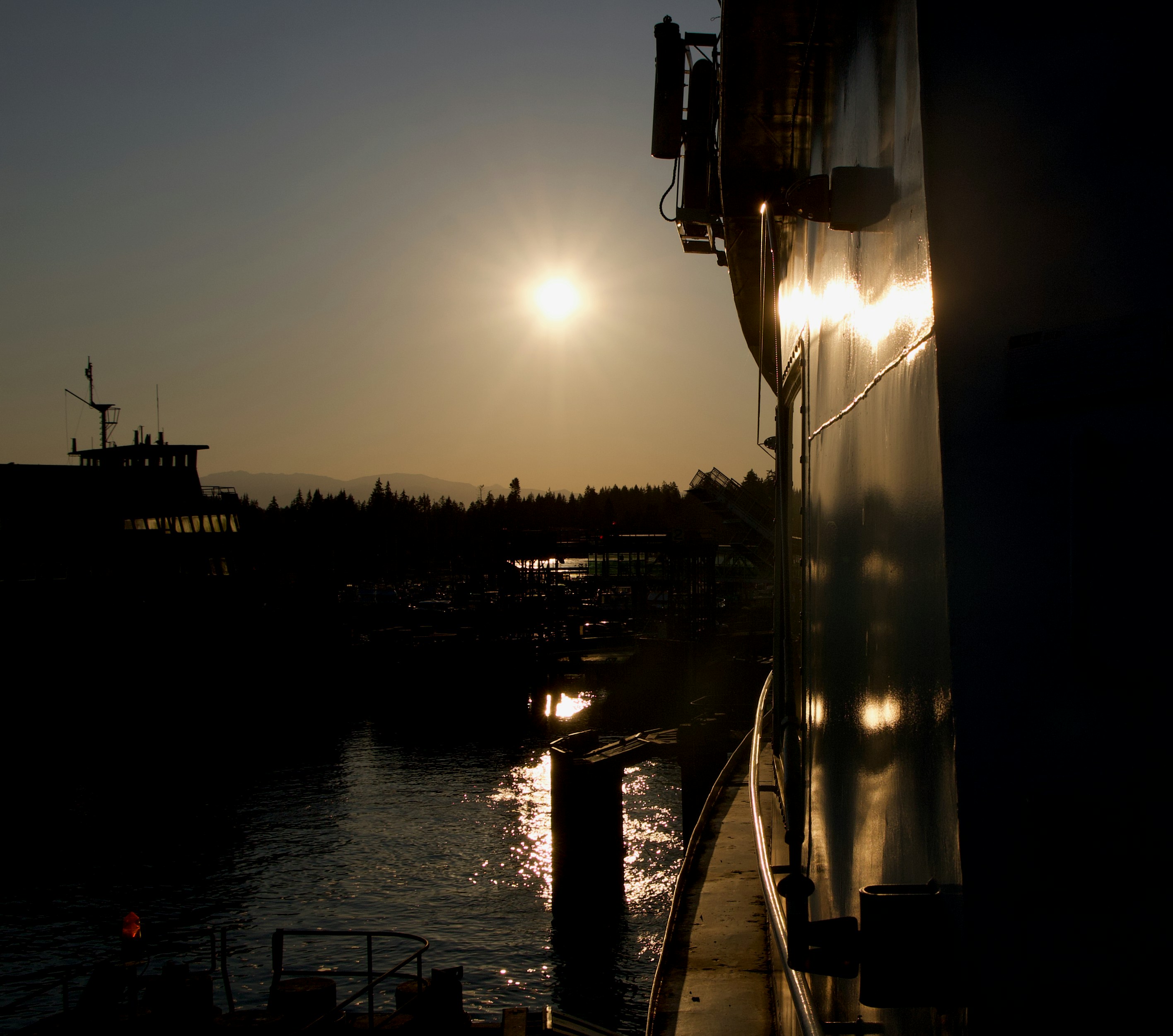 The sun is setting over a body of water