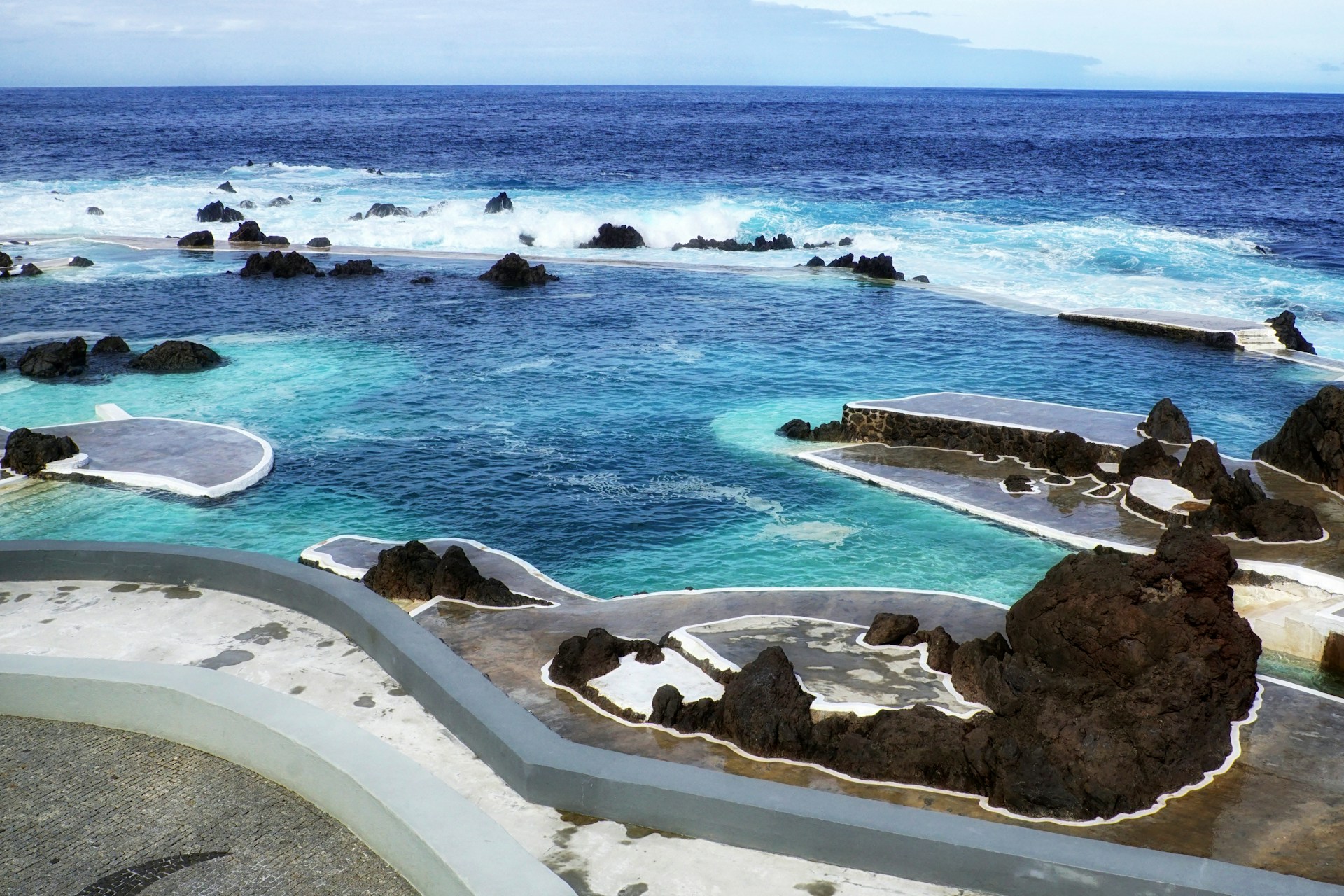 A large body of water surrounded by rocks