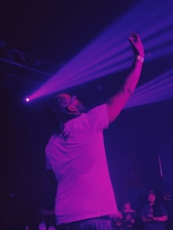 A man standing on a stage holding a microphone