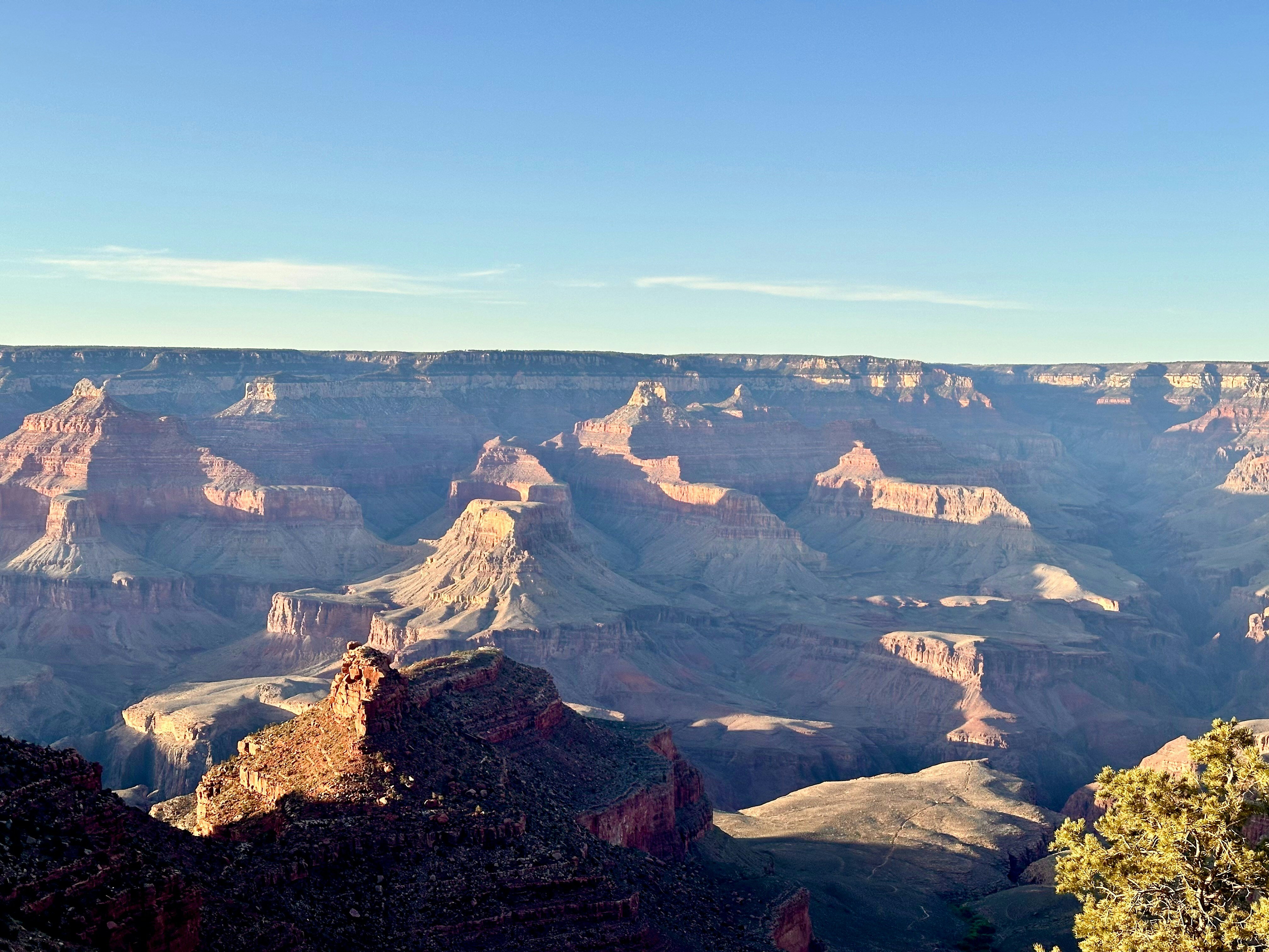 A man standing on the edge of a cliff