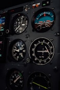 A close up of a plane cockpit with many gauges