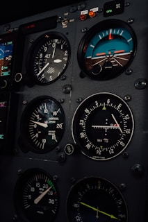 A close up of a plane cockpit with many gauges