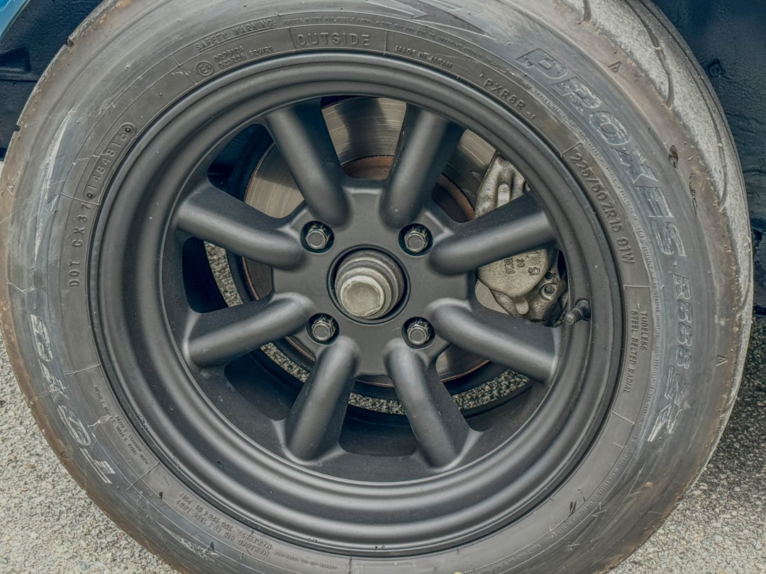 A close up of a tire on a car,