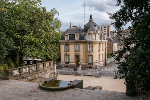 A large building with a fountain in front of it
