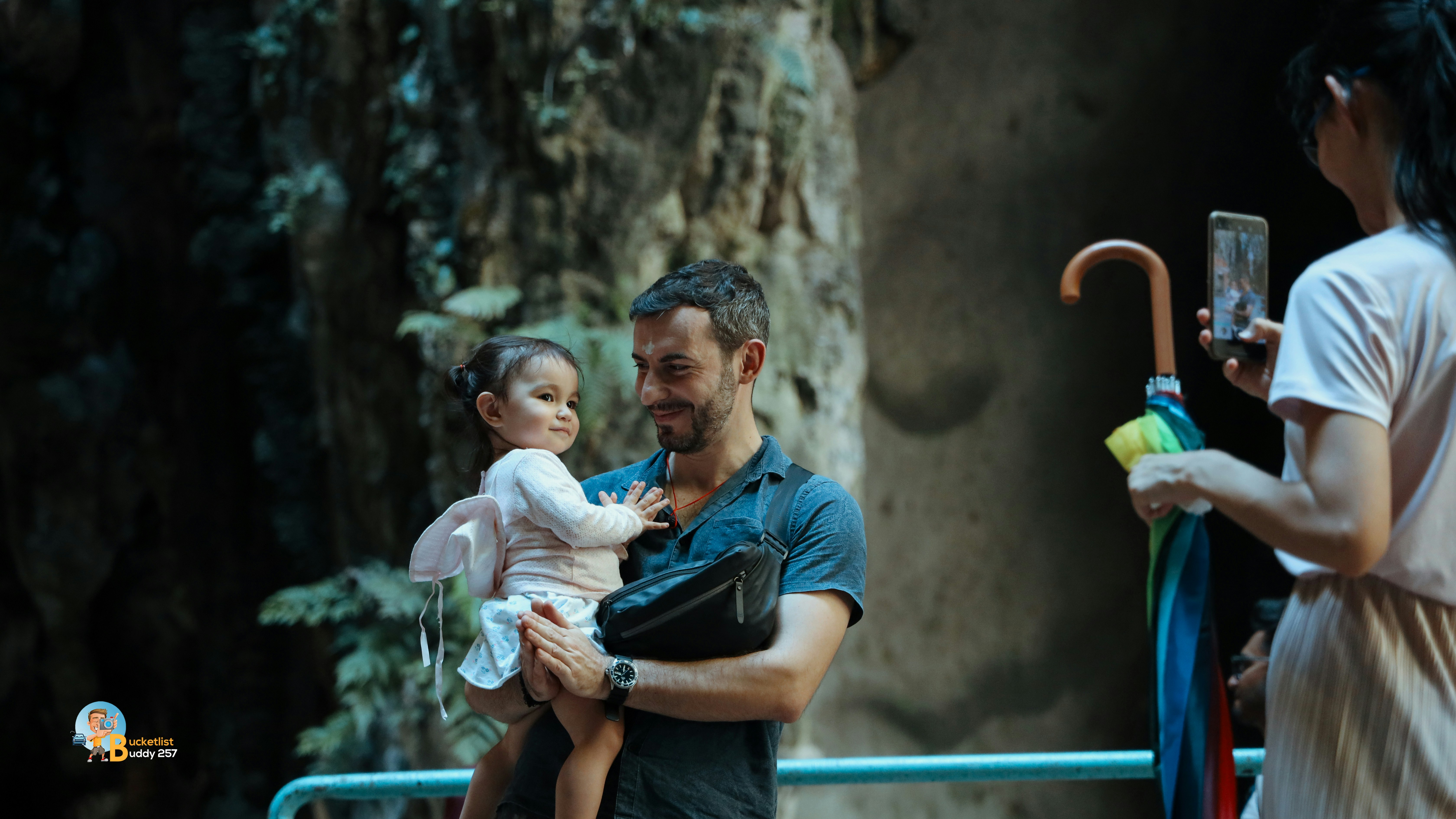 A man holding a baby in his arms