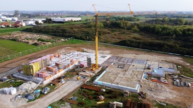An aerial view of a construction site with a crane
