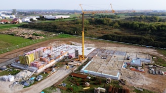 An aerial view of a construction site with a crane