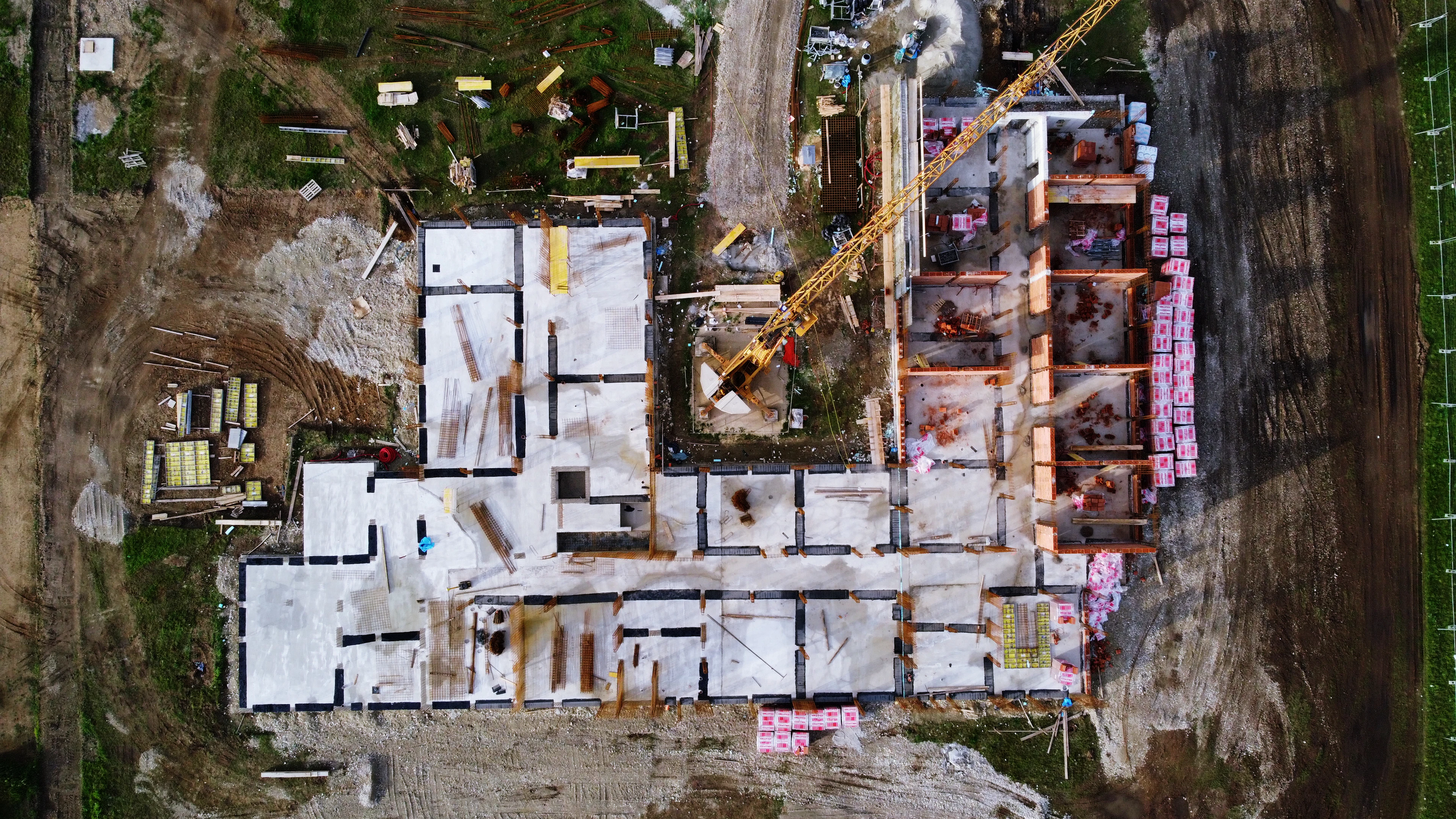 Aerial view of a development plot with foundations being laid — Plots in Sharjah