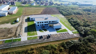 An aerial view of a building in a rural area