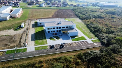An aerial view of a building in a rural area