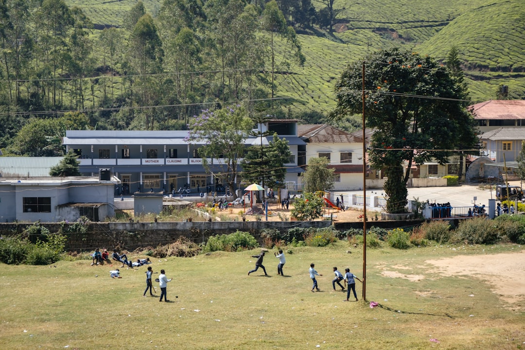 A group of people playing a game of soccer,