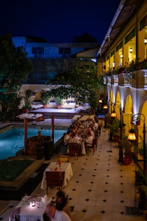 A restaurant with a pool in the middle of it