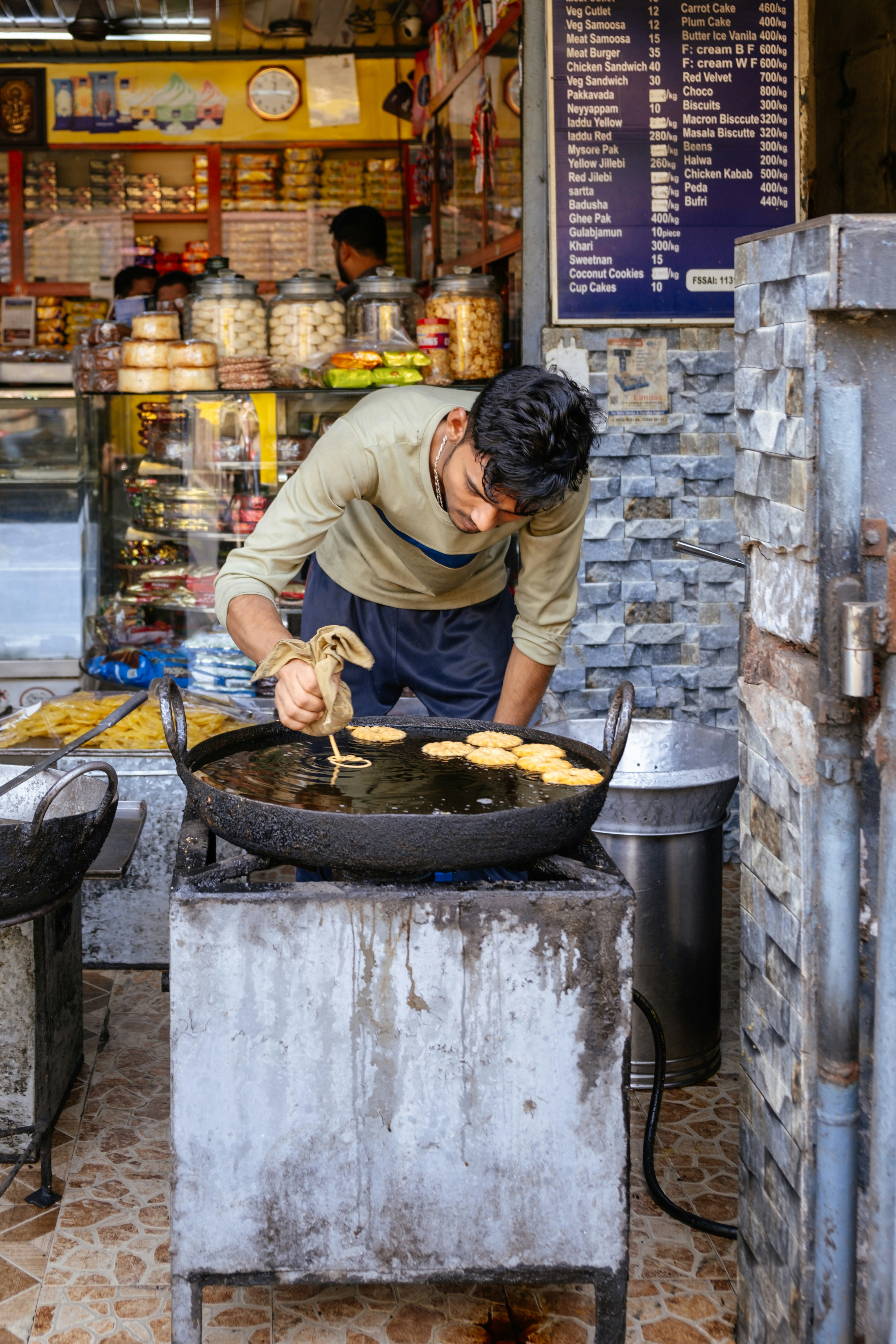 A man cooking food on top of a grill