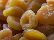 A pile of oranges sitting next to each other