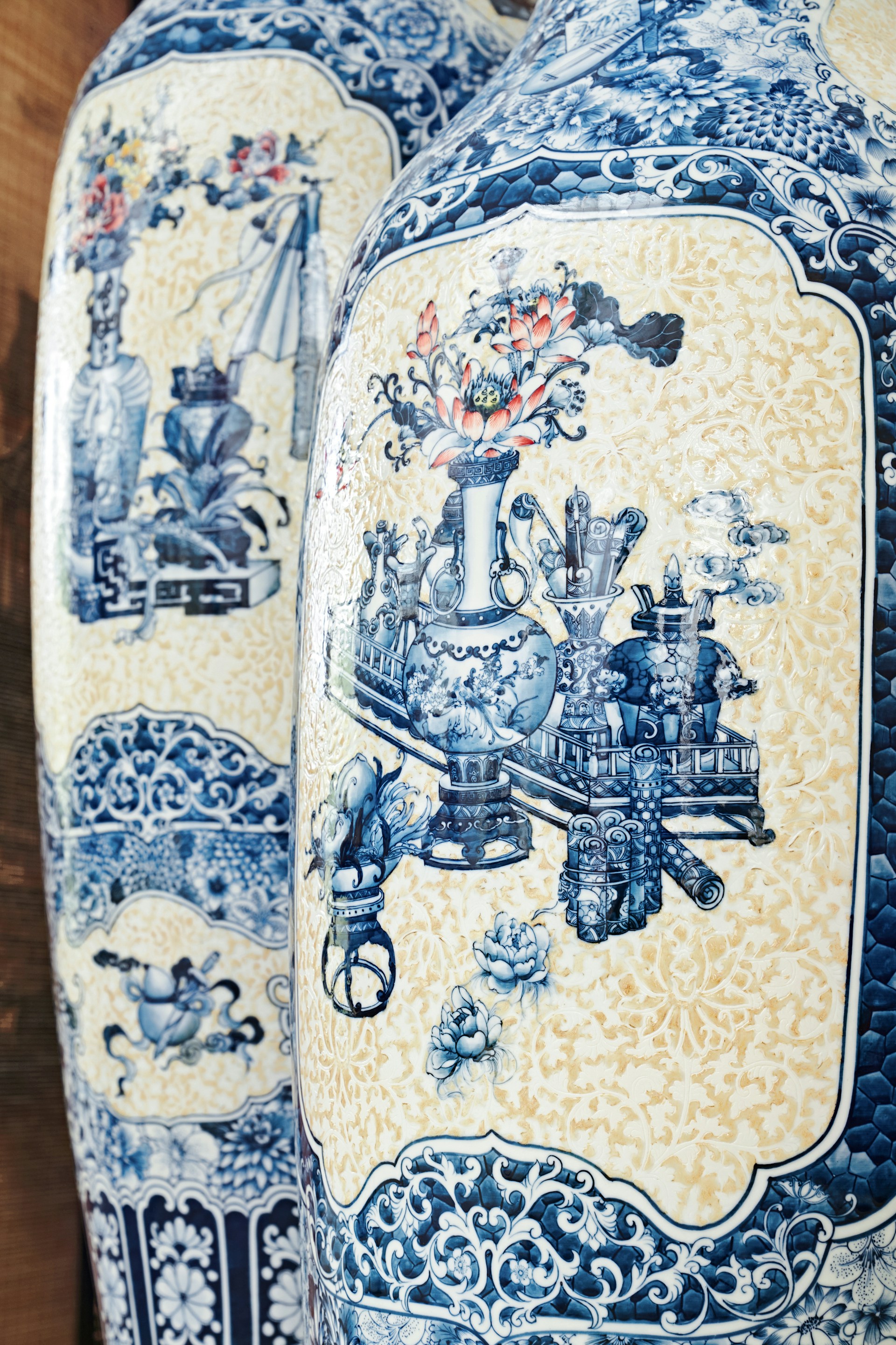 Two blue and white vases sitting next to each other