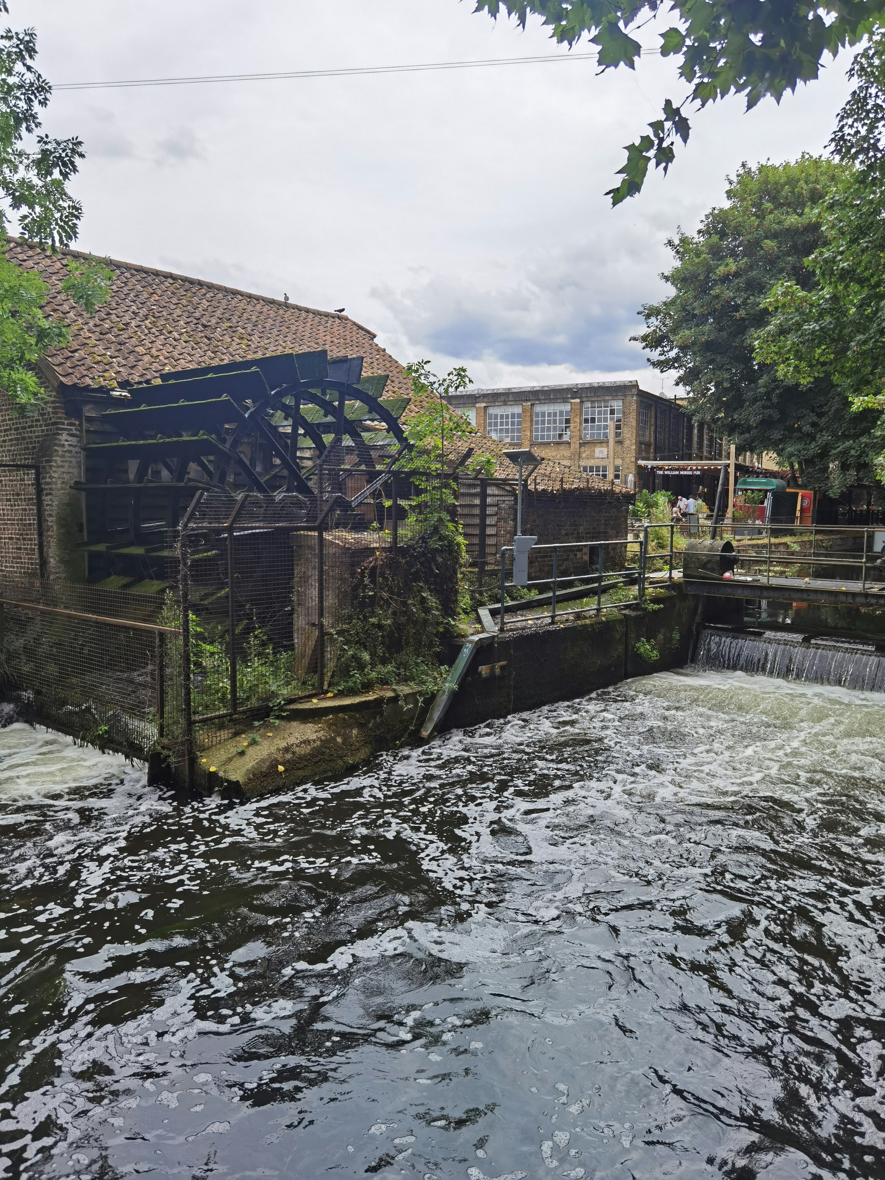 A river running through a small town surrounded by trees