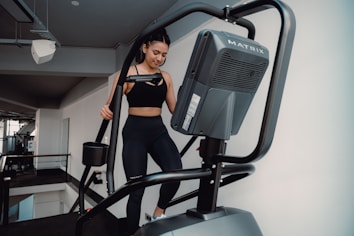 A woman on a treadmill in a gym