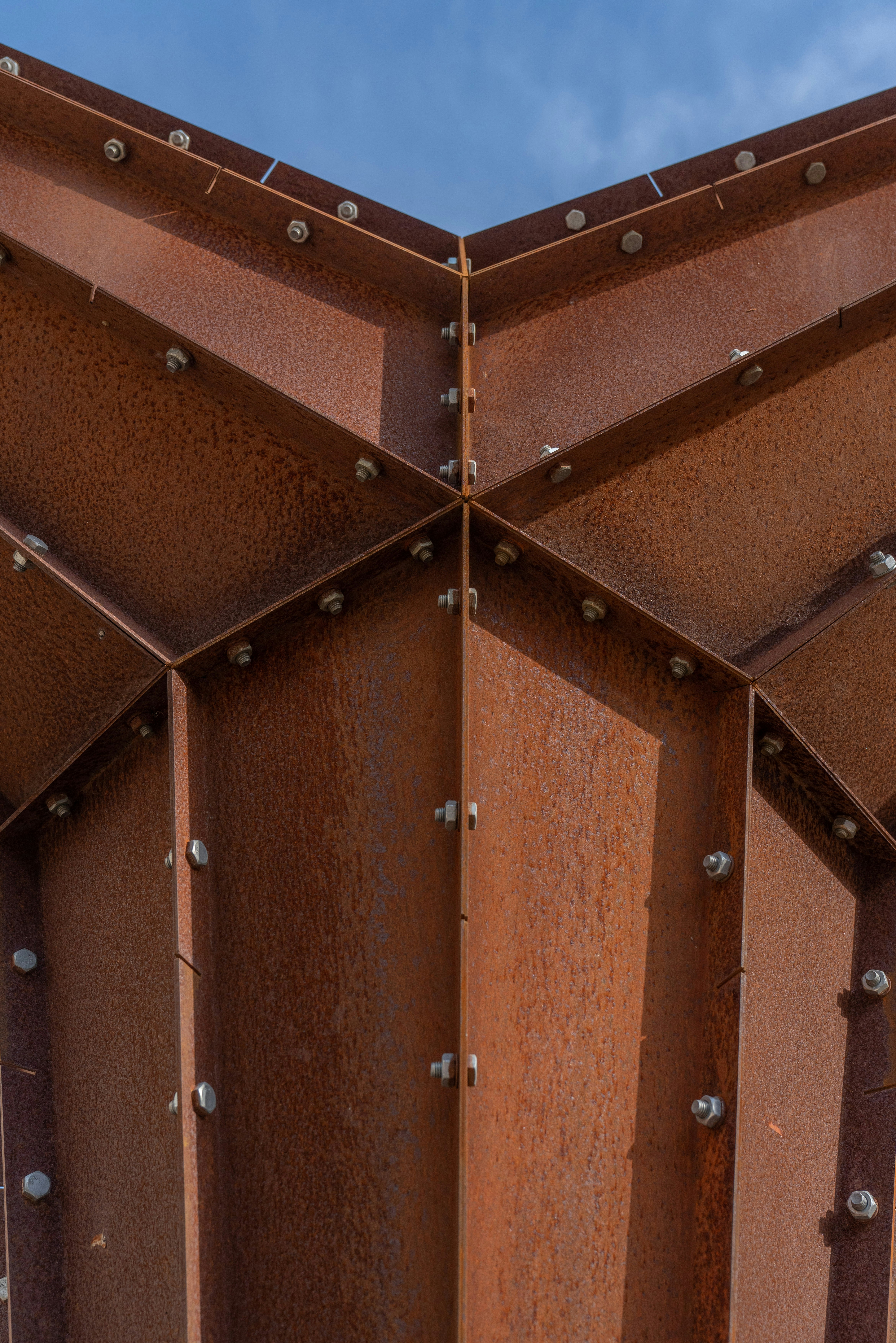A close up of a metal structure with rivets