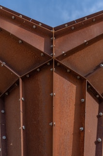 A close up of a metal structure with rivets