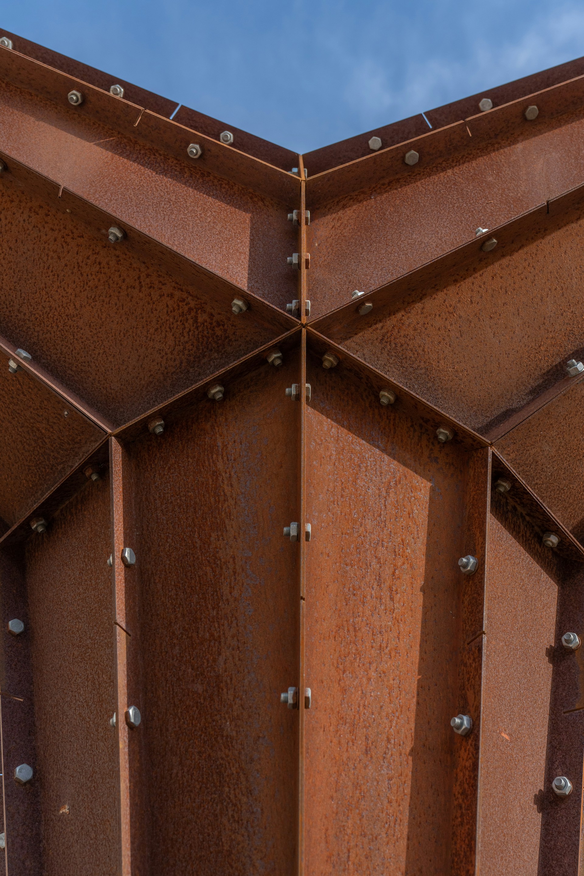 A close up of a metal structure with rivets