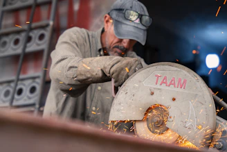 A man working on a piece of metal