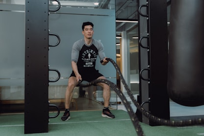 A man in a gym with a HIIT Routine