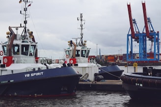 A couple of boats that are sitting in the water