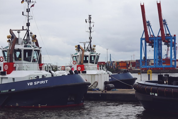 A couple of boats that are sitting in the water