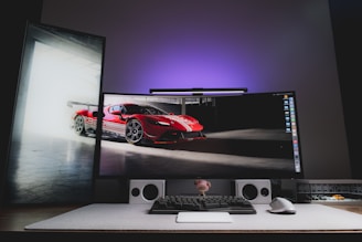 A computer monitor sitting on top of a desk