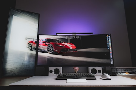 A computer monitor sitting on top of a desk