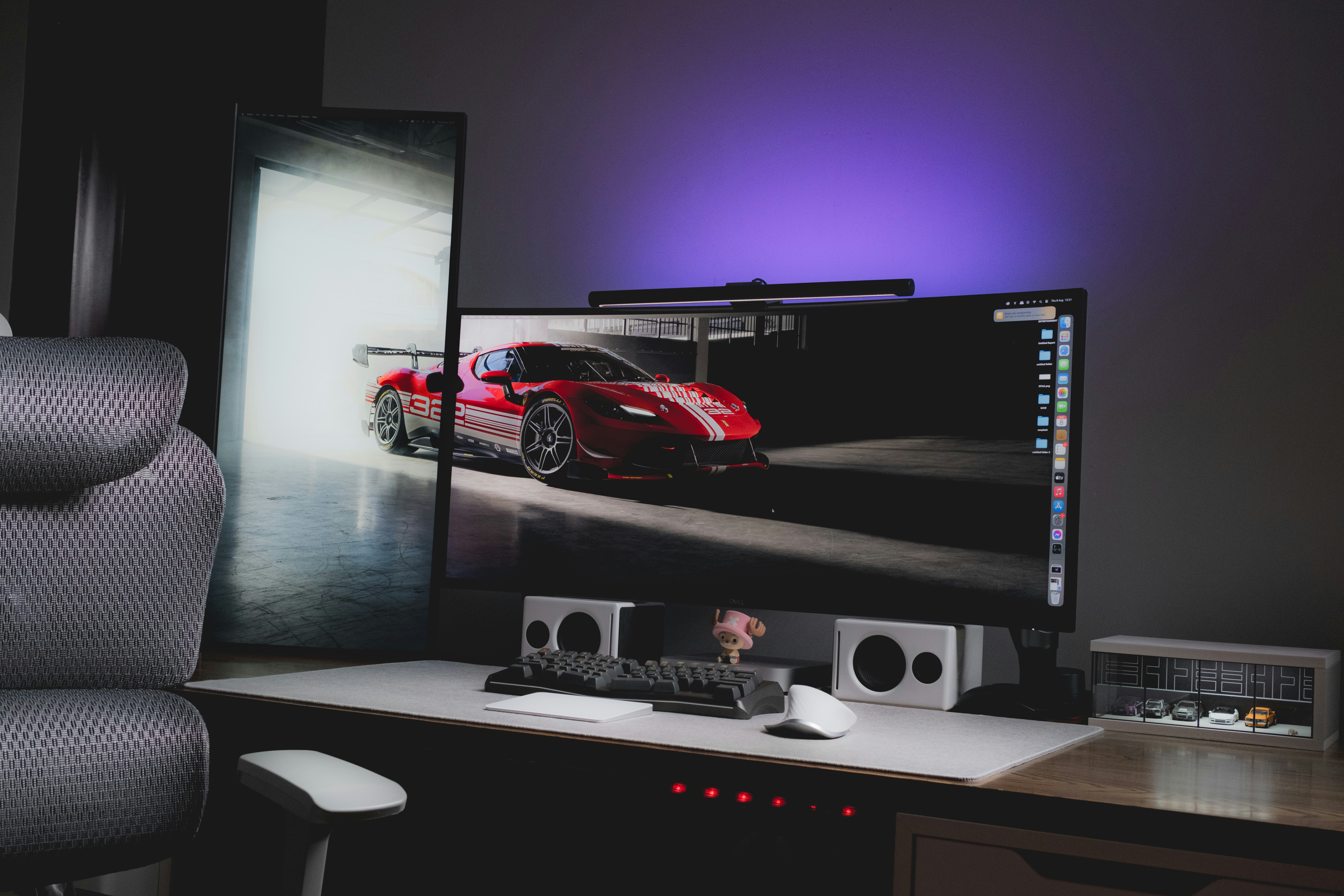 A computer desk with a monitor and keyboard