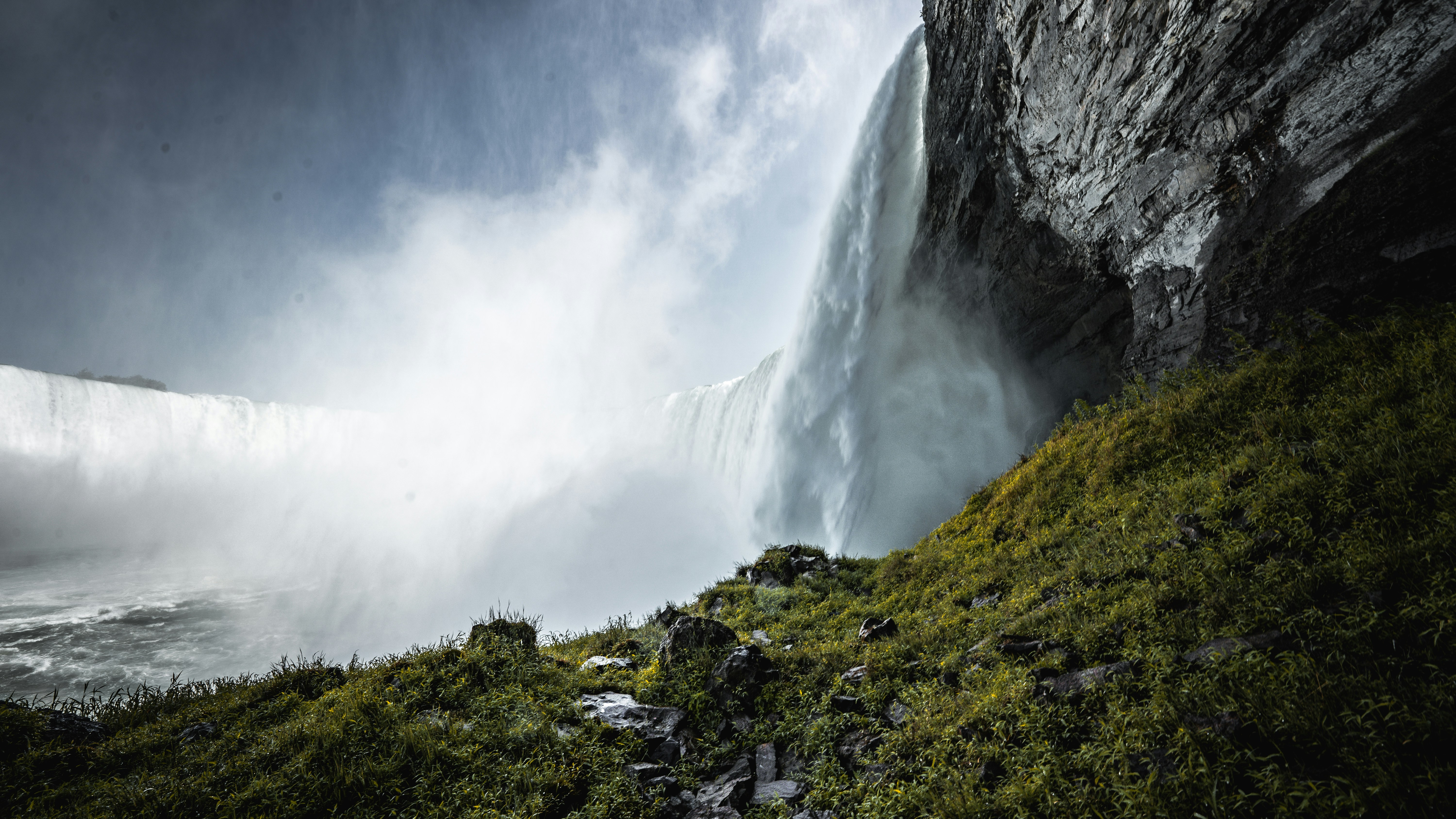 A large waterfall with water coming out of it