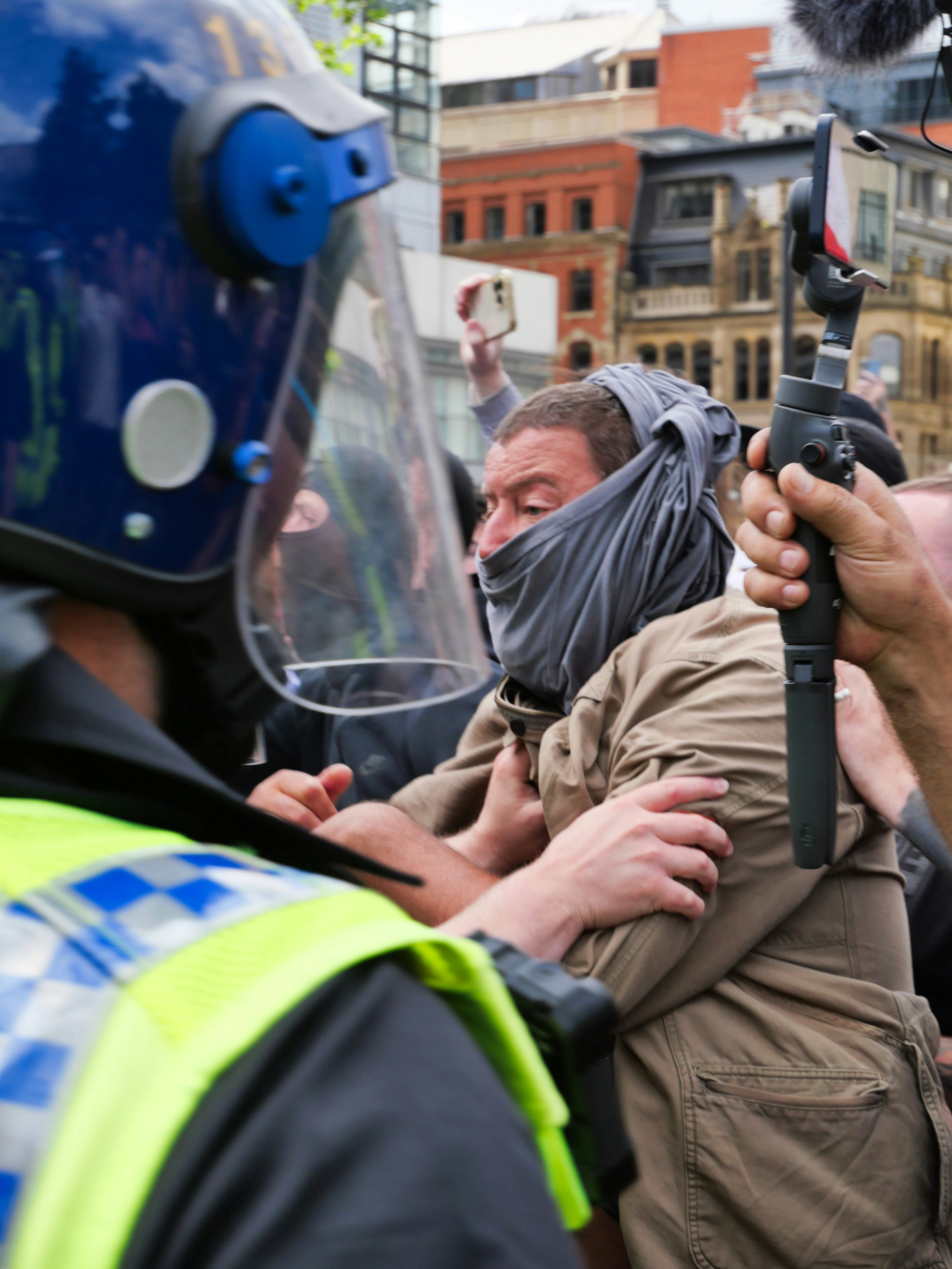 A group of people standing around each other