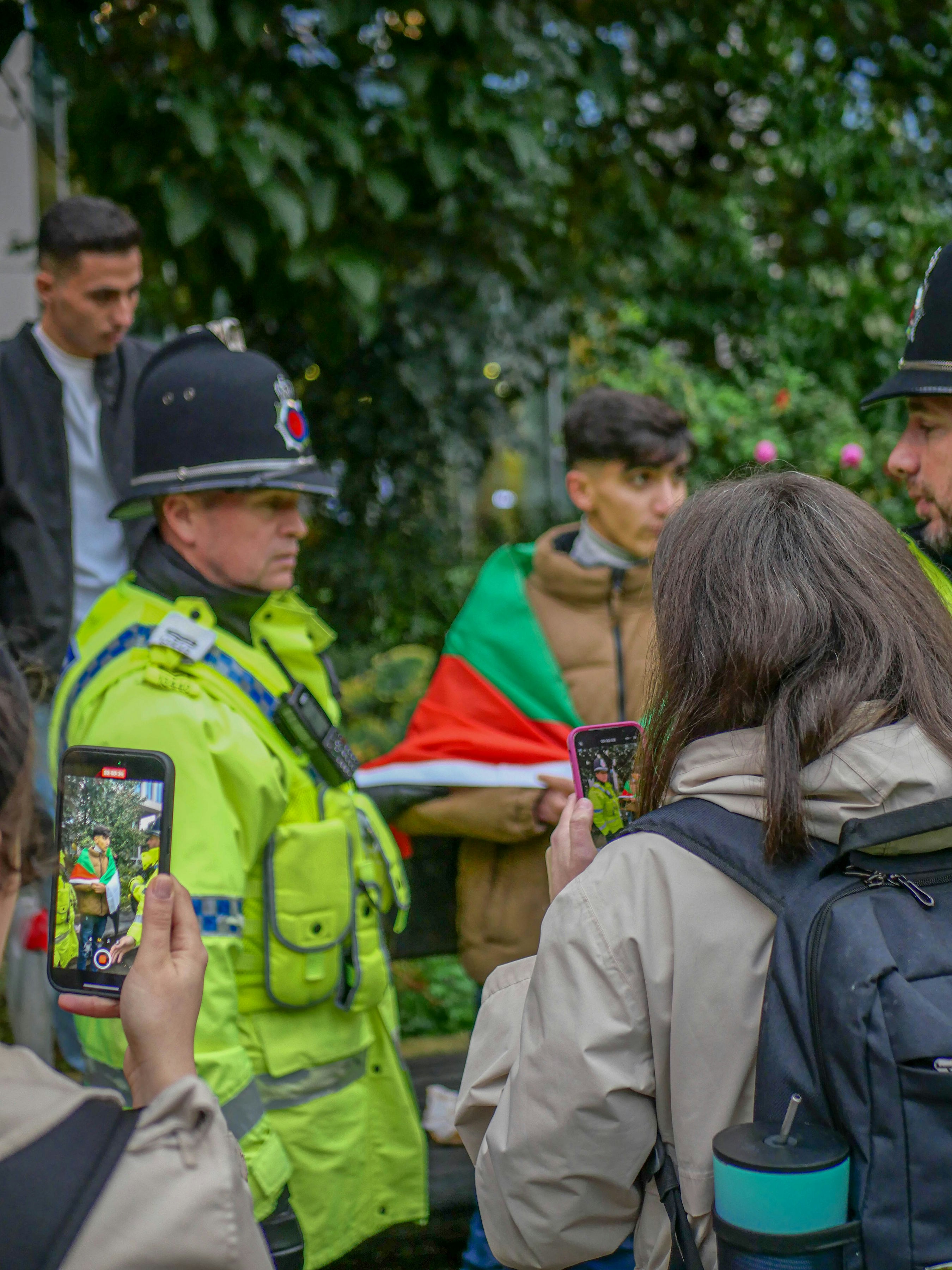A group of people standing around each other