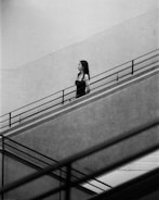 A woman walking down a flight of stairs