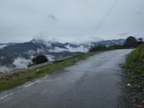 A view of a road with mountains in the background