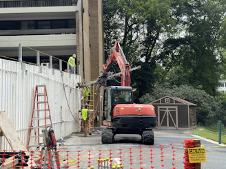 A construction site with a crane and construction equipment
