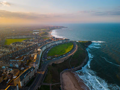 A bird's eye view of a city next to the ocean in Tynemouth 