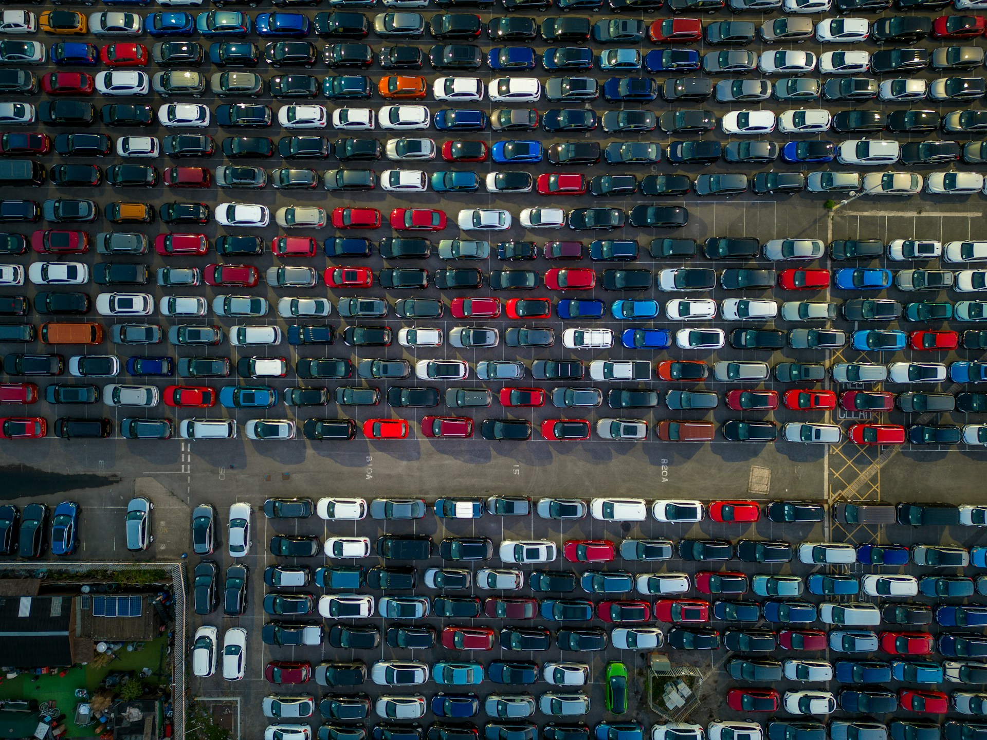 A parking lot filled with lots of parked cars