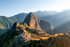 The sun shines on the ruins of a mountain