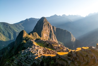 The sun shines on the ruins of a mountain