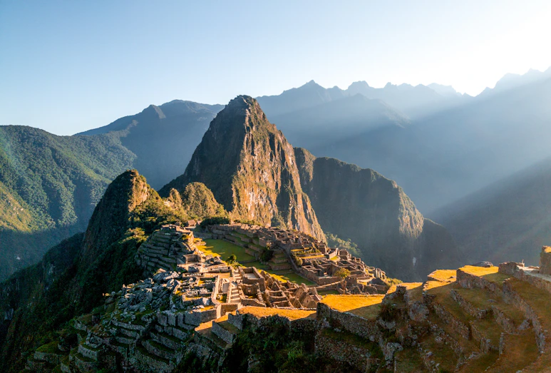 The sun shines on the ruins of a mountain