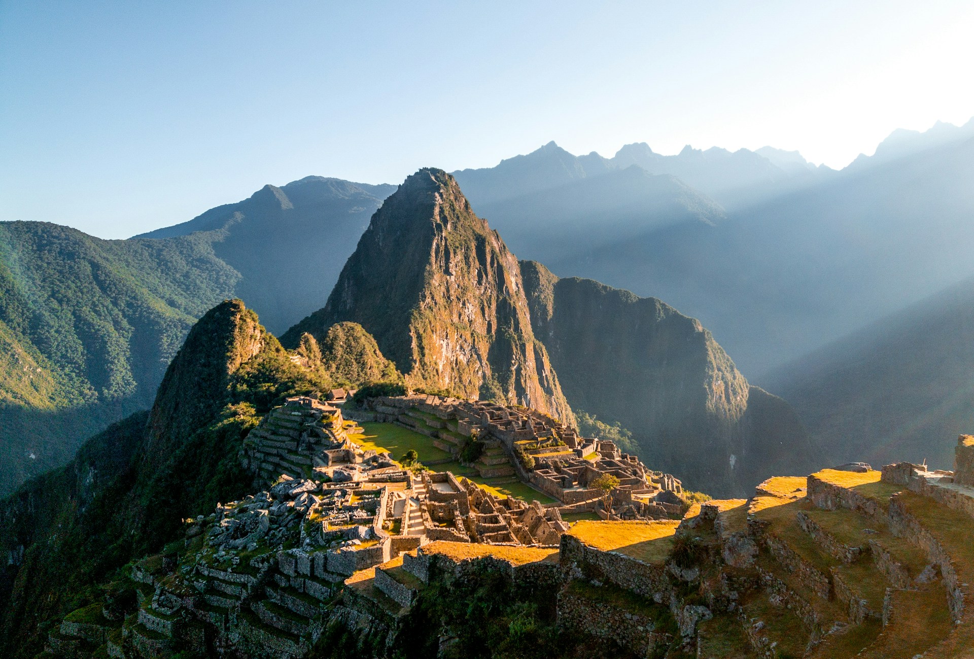 The sun shines on the ruins of a mountain