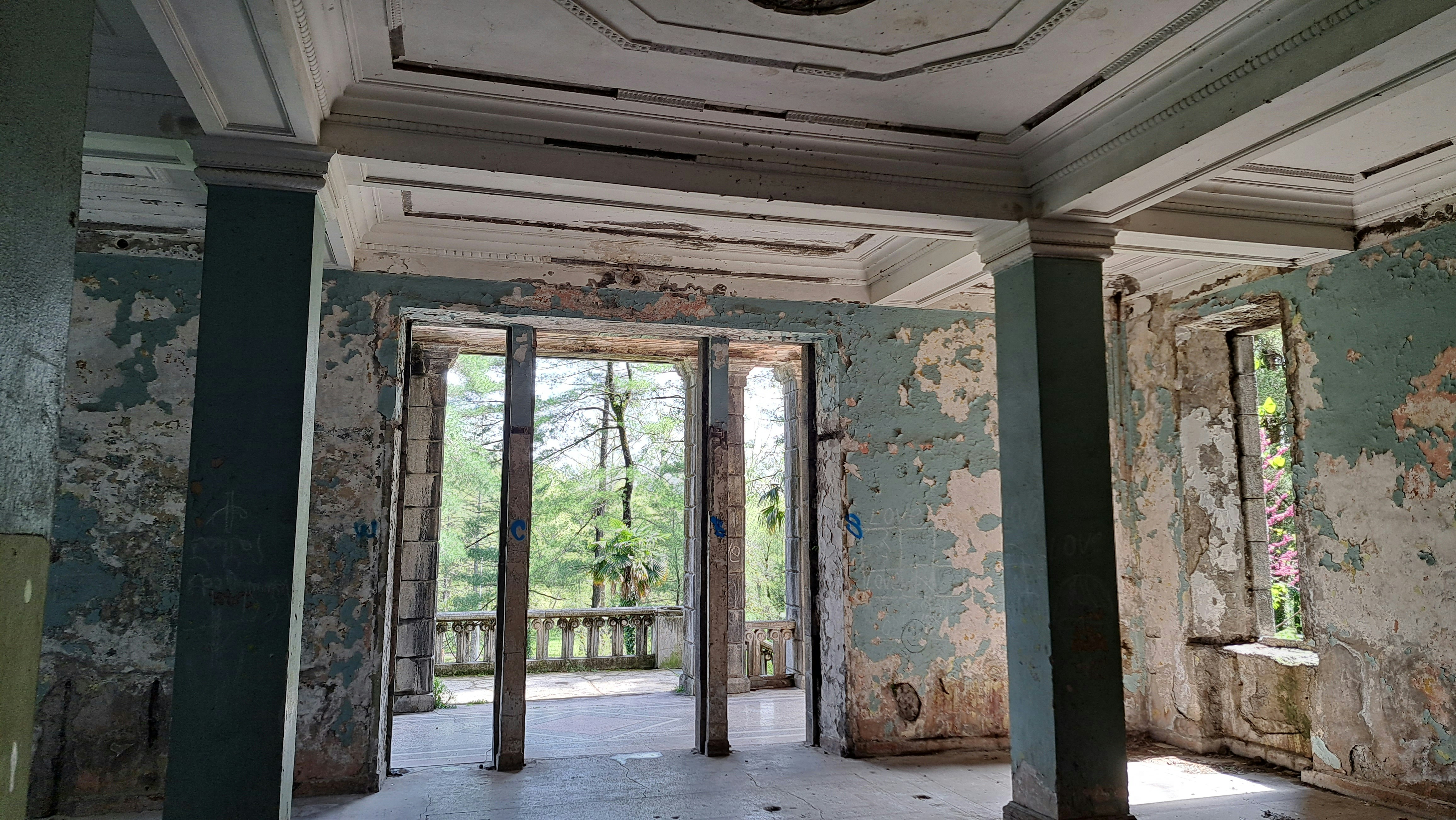 An empty room with a lot of paint on the walls