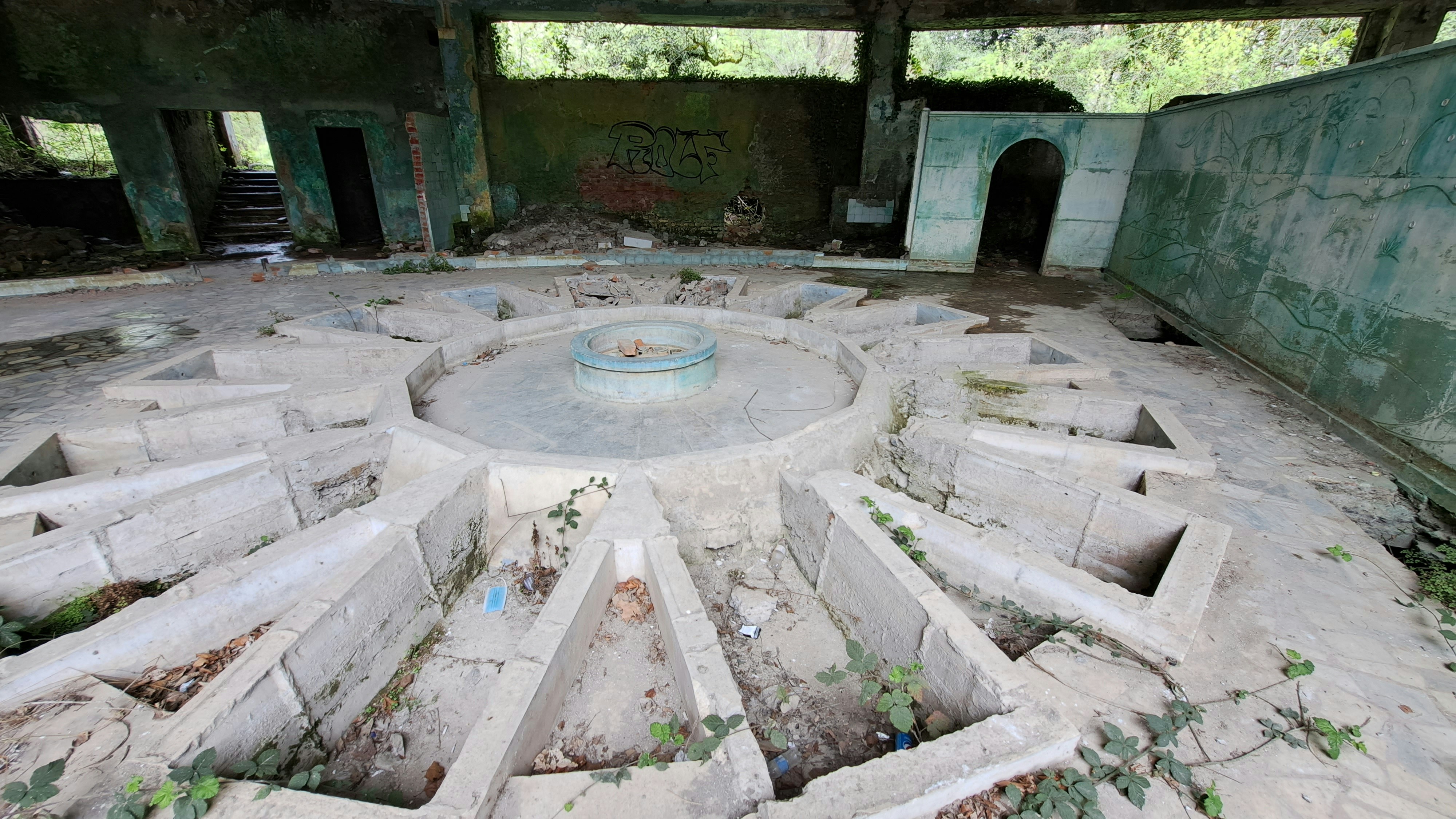 An old building with a circular hole in the middle