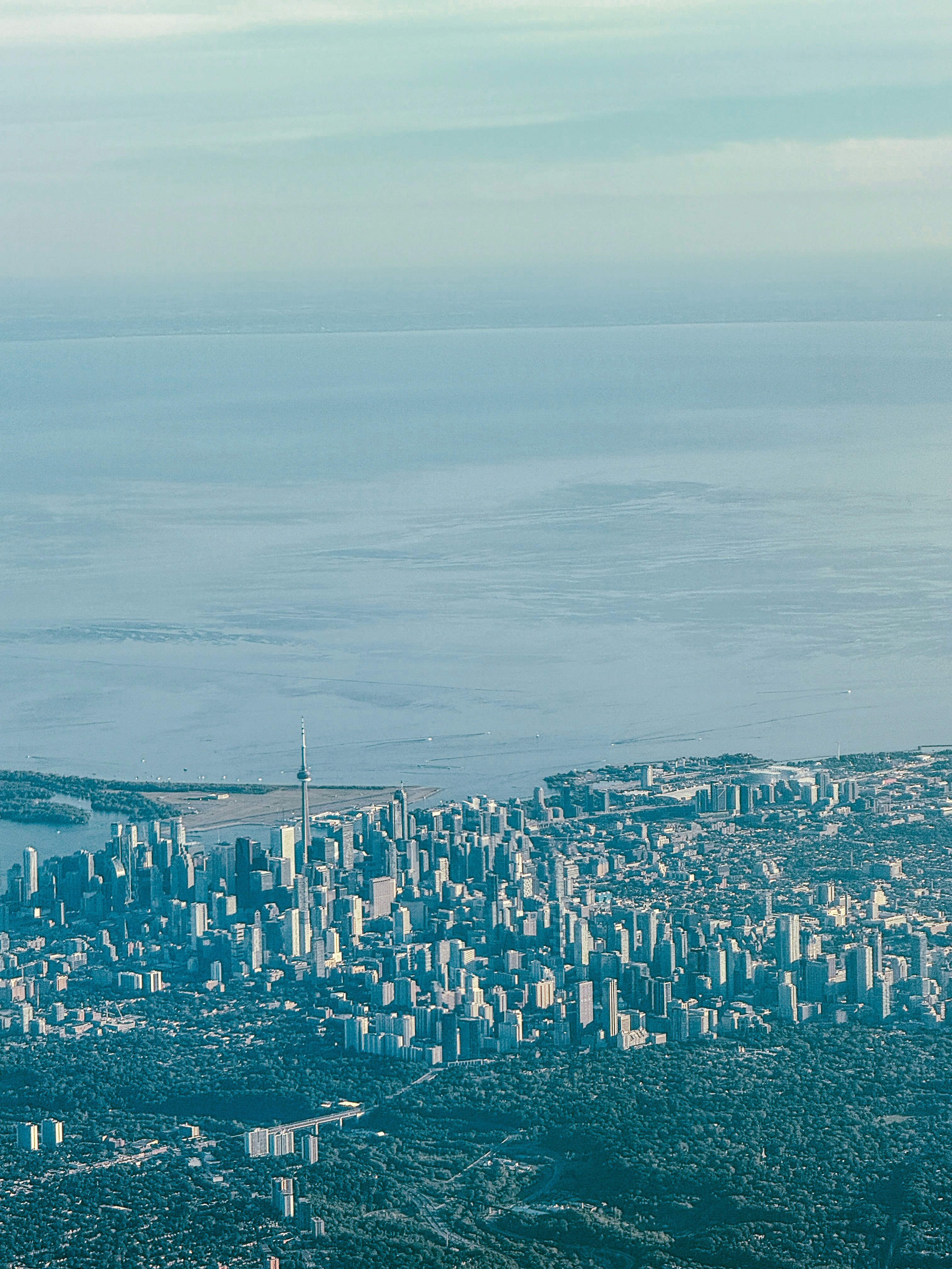 An aerial view of a city and a body of water