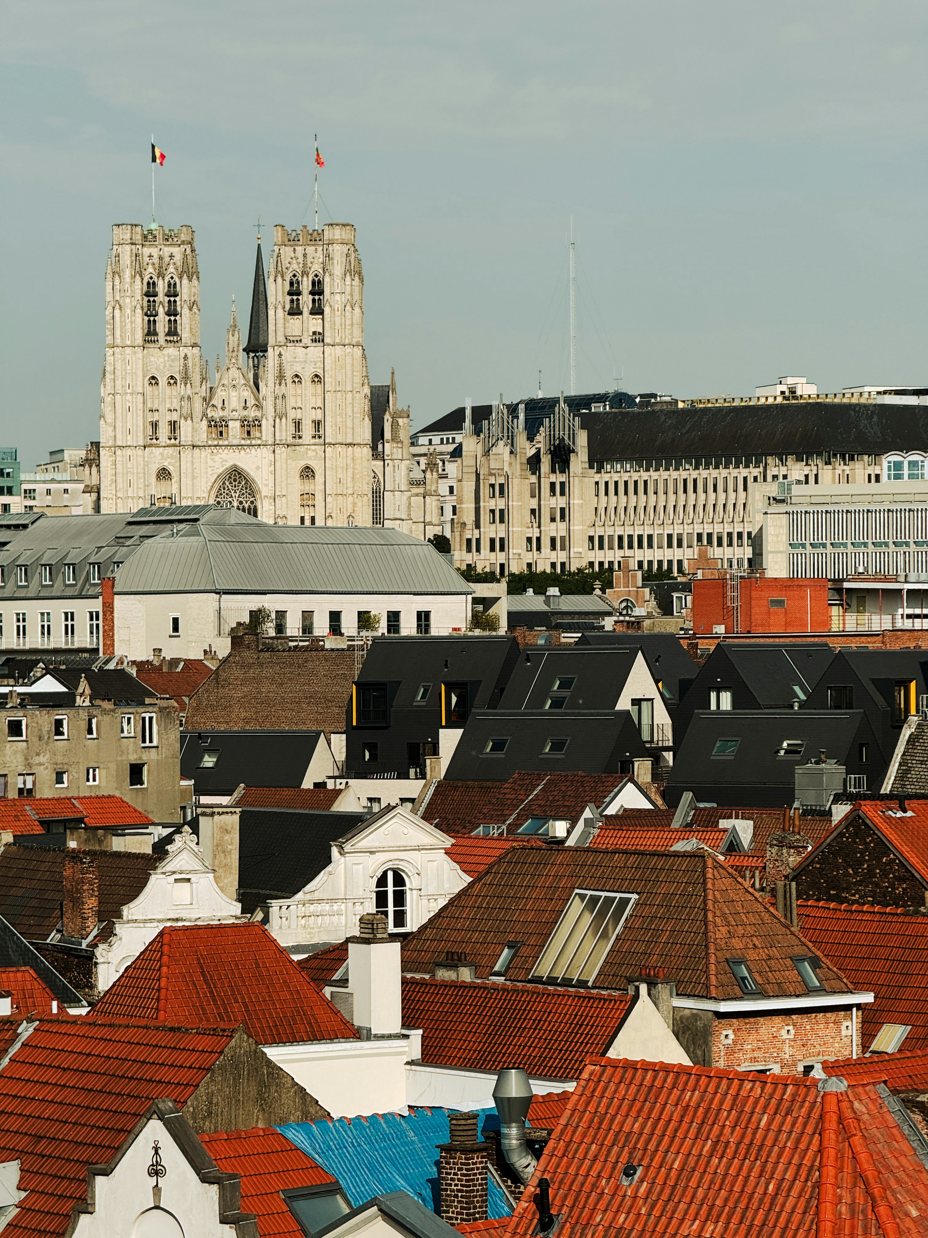 A view of a city with a cathedral in the background